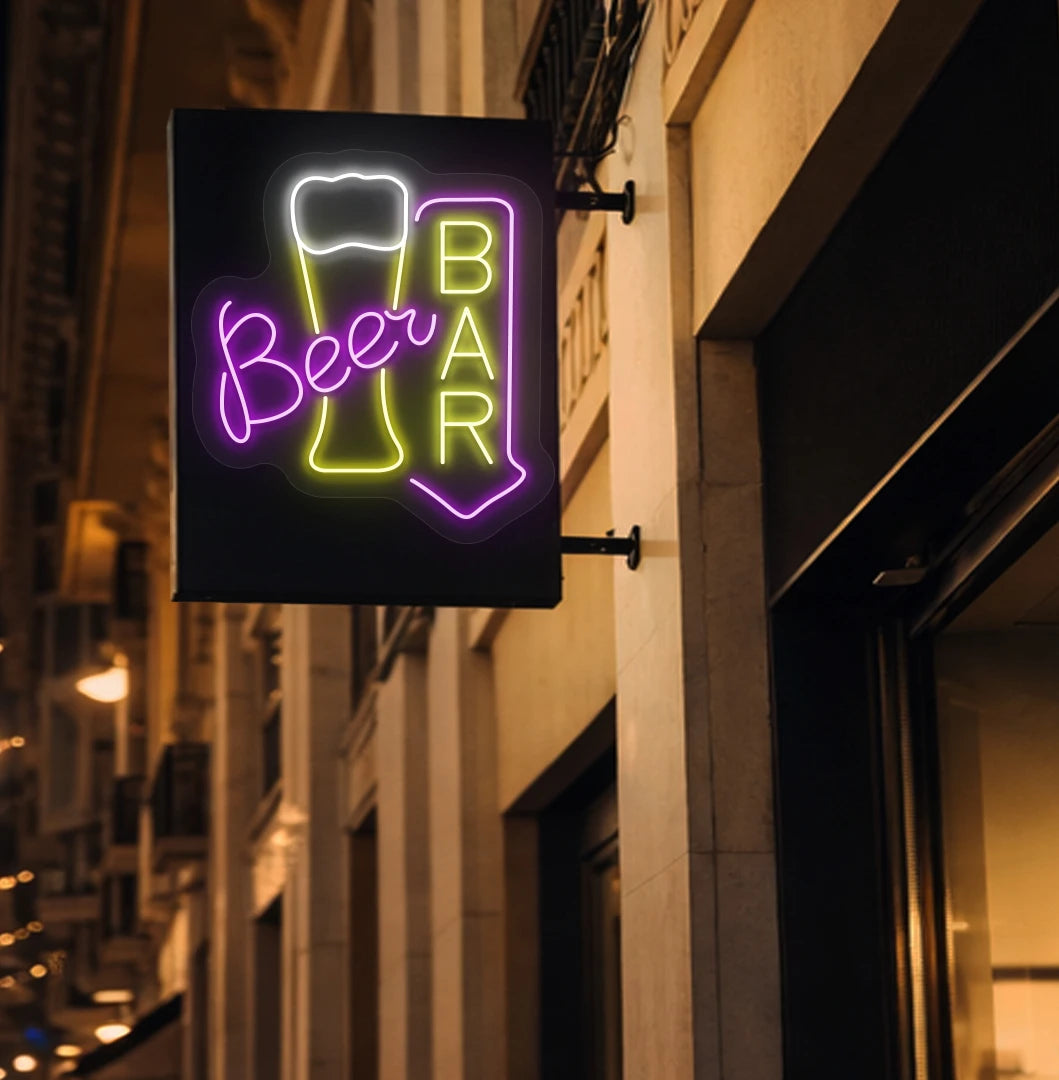 Trendy beer bar arrow neon sign in yellow mounted on wall.
