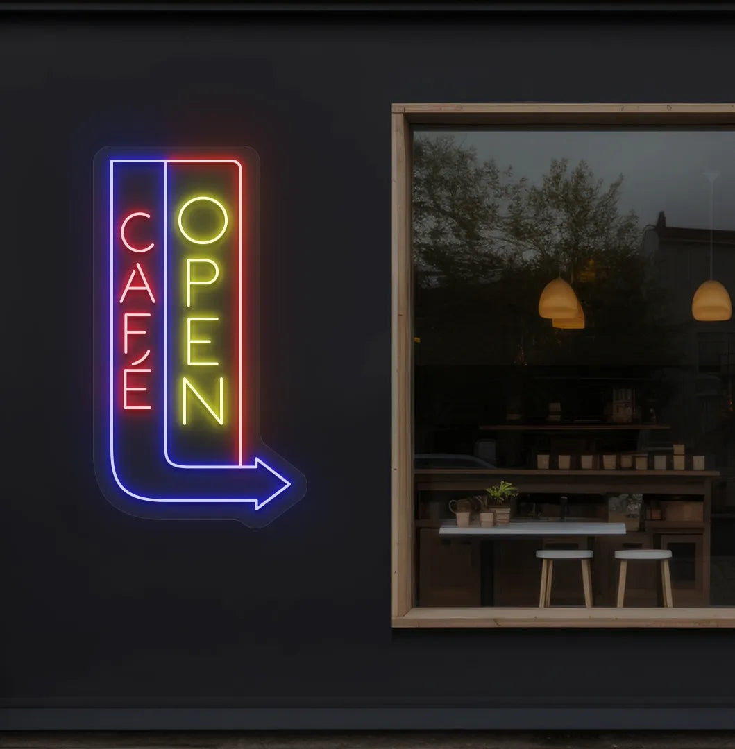 Trendy Cafe Open yellow neon sign with arrow mounted on coffee shop wall