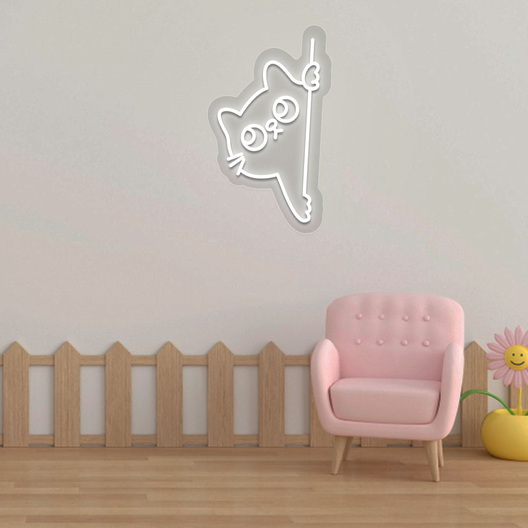 Image of a peeking cat LED neon sign hanging on a kid's bedroom wall in white color.
