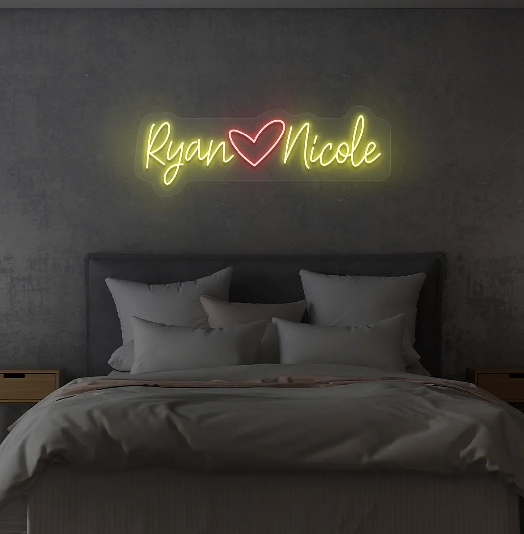 Personalized yellow LED name sign mounted on modern bedroom wall.