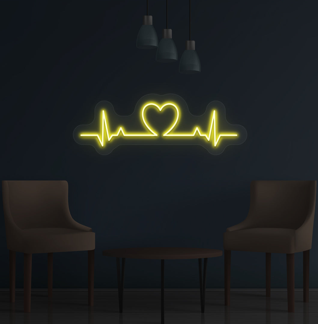 Stylish yellow LED heartbeat neon sign glowing on wall.