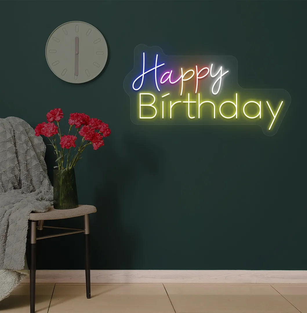 Trendy multicolor Happy Birthday neon sign mounted on party backdrop wall in yellow color.