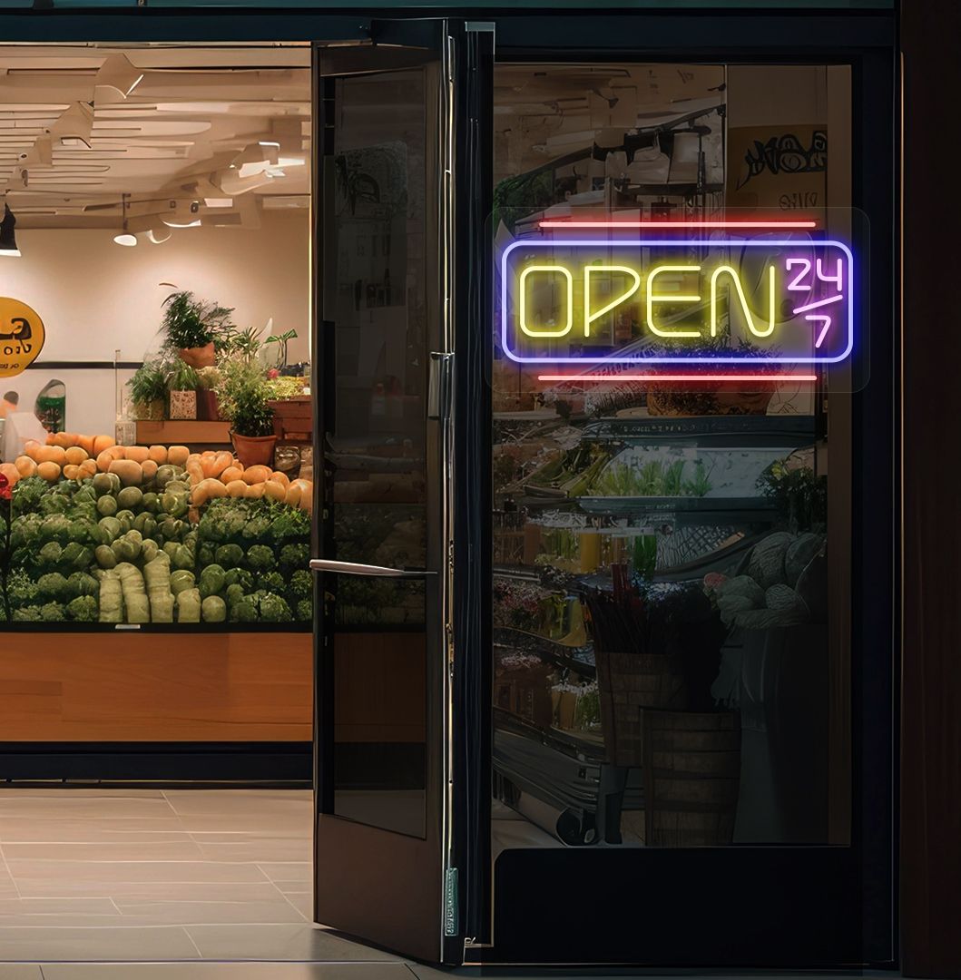Modern open 24/7 neon sign glowing yellow on supermarket door.