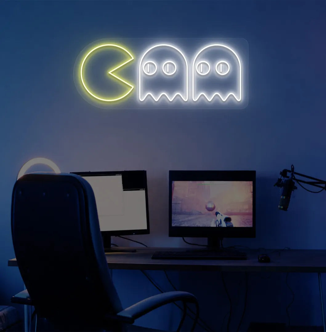 Image of a retro arcade Pacman neon sign mounted on gamer room wall in white color.