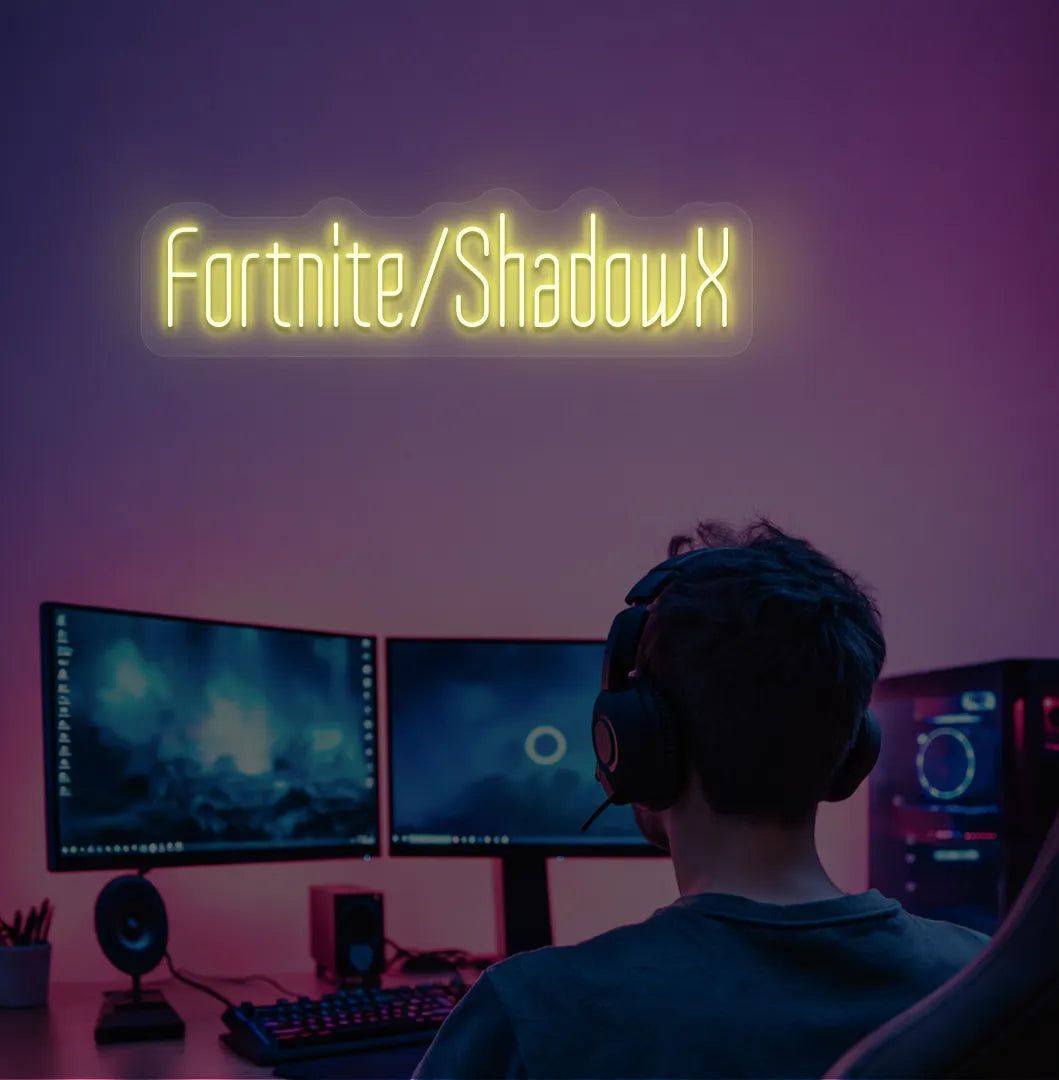 Modern gaming setup featuring Personalized Game and Name blue neon sign in yellow color.