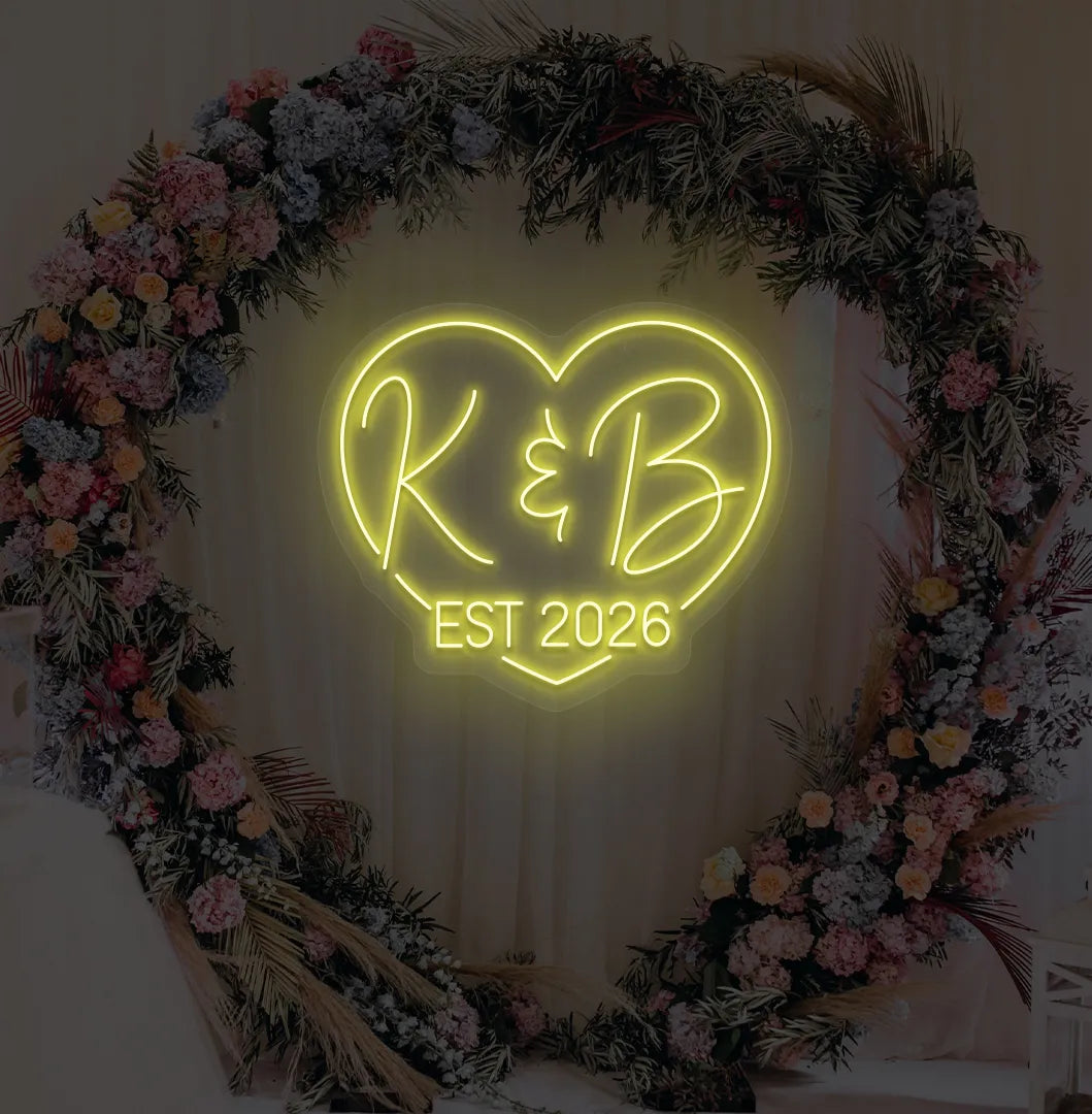 Image of a custom wedding EST neon sign in yellow color on aesthetic wall decor.