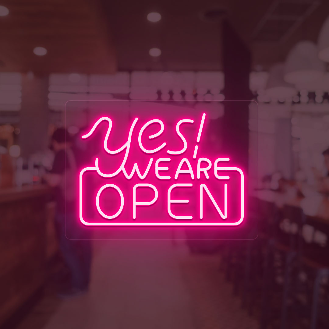 Image of a "Yes, we are open" neon sign glowing on a shop door in pink color.