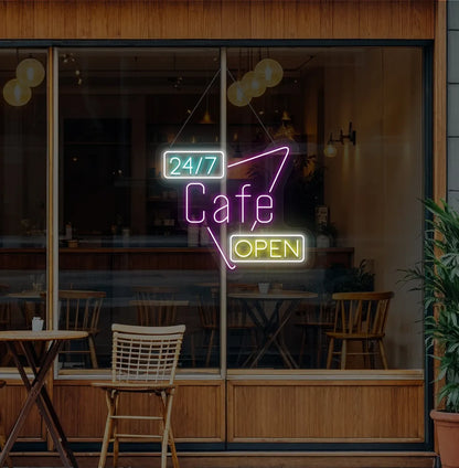 Trendy 24/7 cafe open neon sign in purple mounted on coffee shop wall.