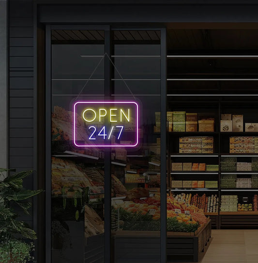 Image of storefront glass door with "24/7 open" neon sign glowing blue.