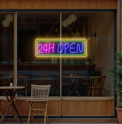 Image of a 24-Hour Open neon sign hanging on cafe glass door in blue color.