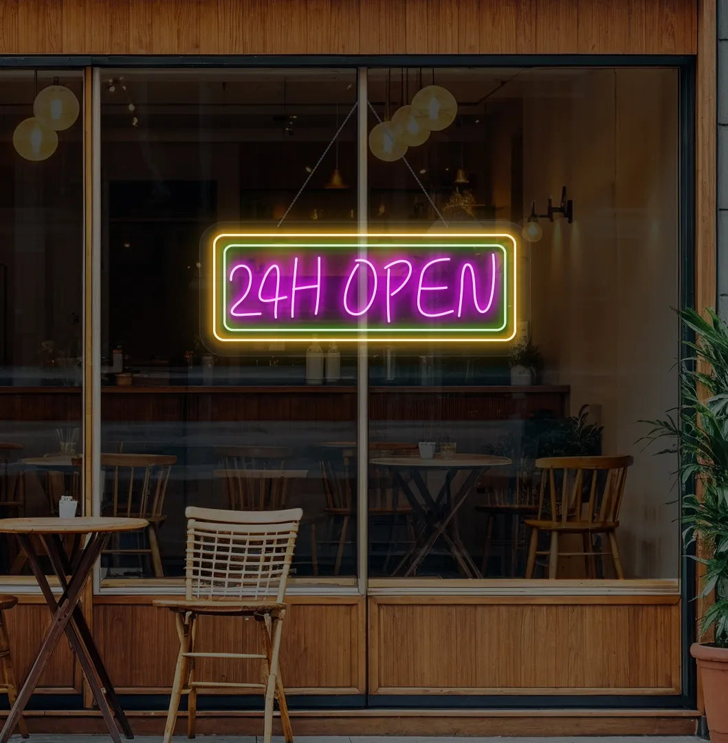 Image of a 24-Hour Open neon sign hanging on cafe glass door in pink color.