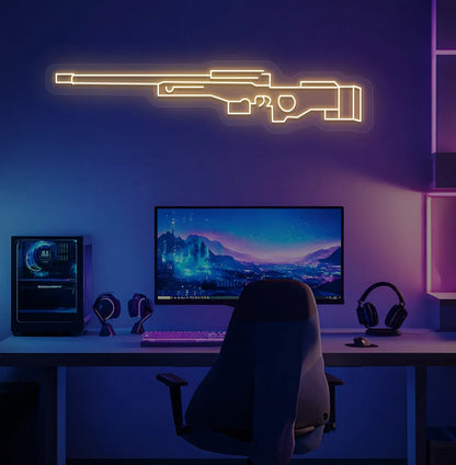 Green "AWM gaming gun" LED neon sign glowing orange on aesthetic gaming room.