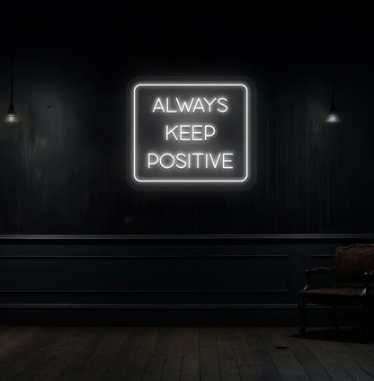Image of an "Always keep positive" neon sign in white color mounted on aesthetic wall.