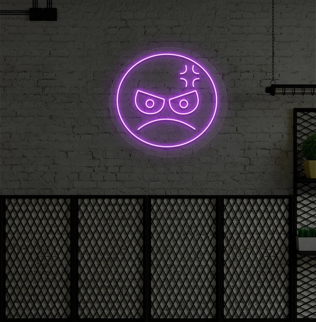 Modern wall decor with angry emoji neon sign mounted on a wall in purple.