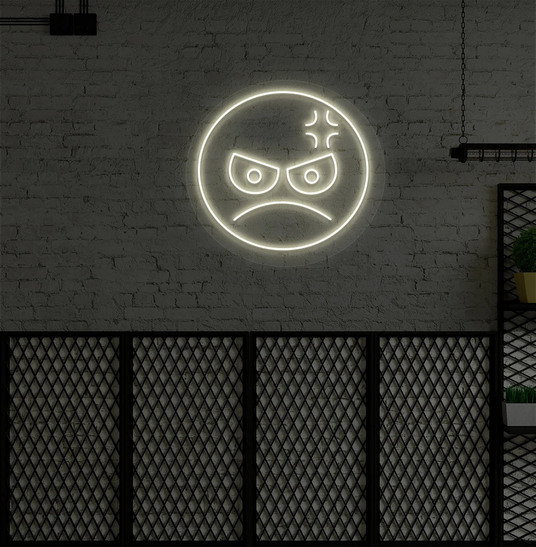 Modern wall decor with angry emoji neon sign mounted on a wall in warm white.