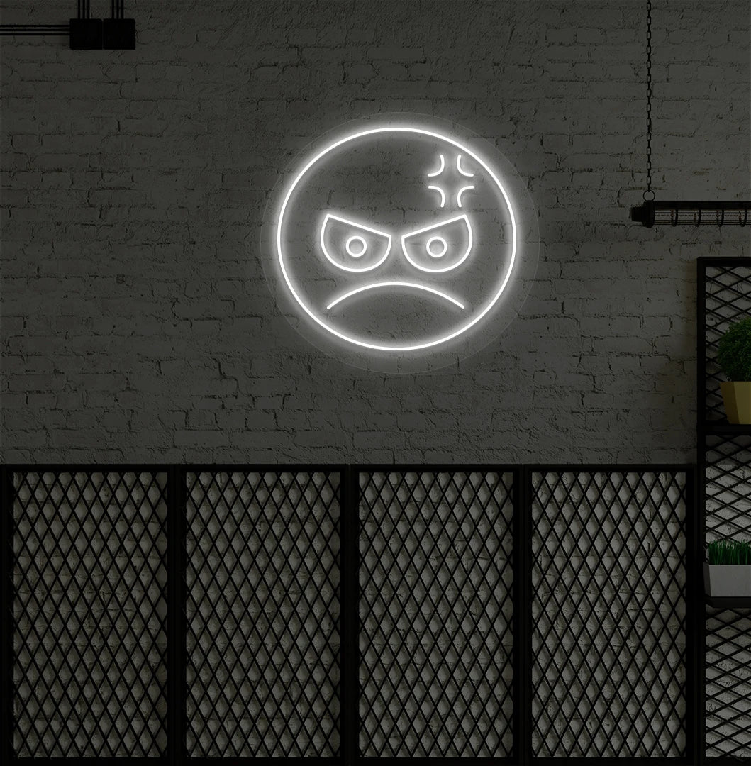 Image of an angry emoji neon sign glowing on aesthetic wall in white color.