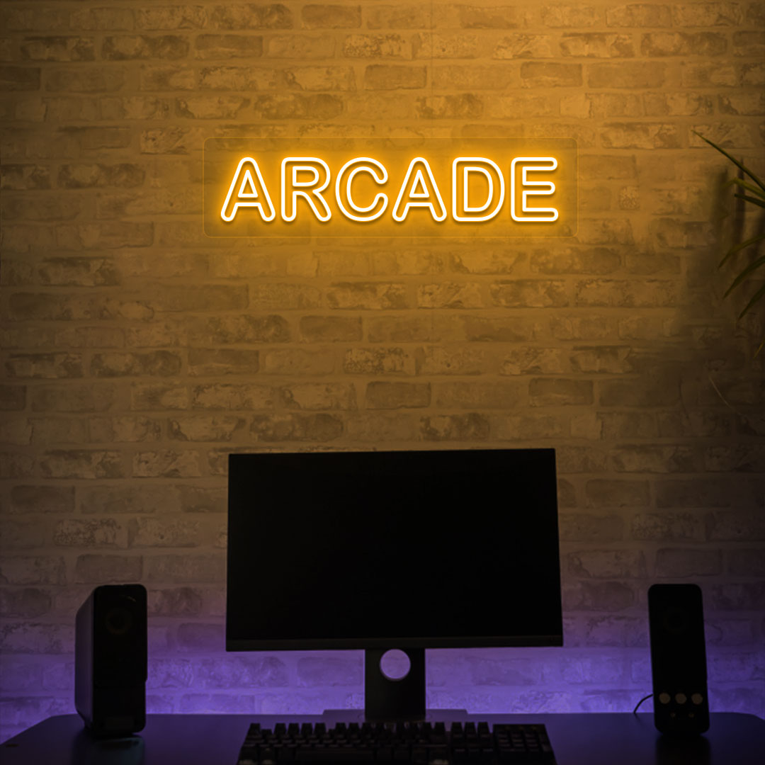 Image of an arcade LED neon sign glowing on a gaming room wall in orange.