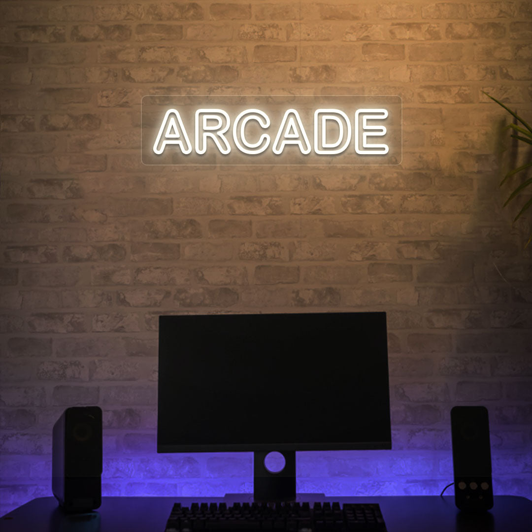 Image of an arcade LED neon sign glowing on a gaming room wall in warm white.