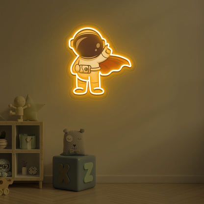 Image of a flying astronaut neon sign glowing on a kid's bedroom wall in orange color.