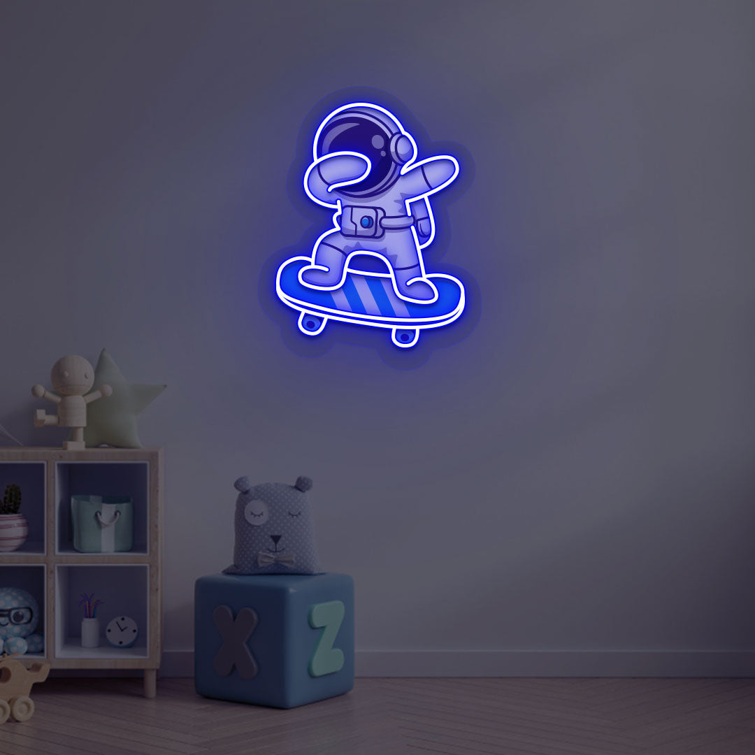 Space-themed kids' room wall with astronaut on skateboard neon sign in blue LED.