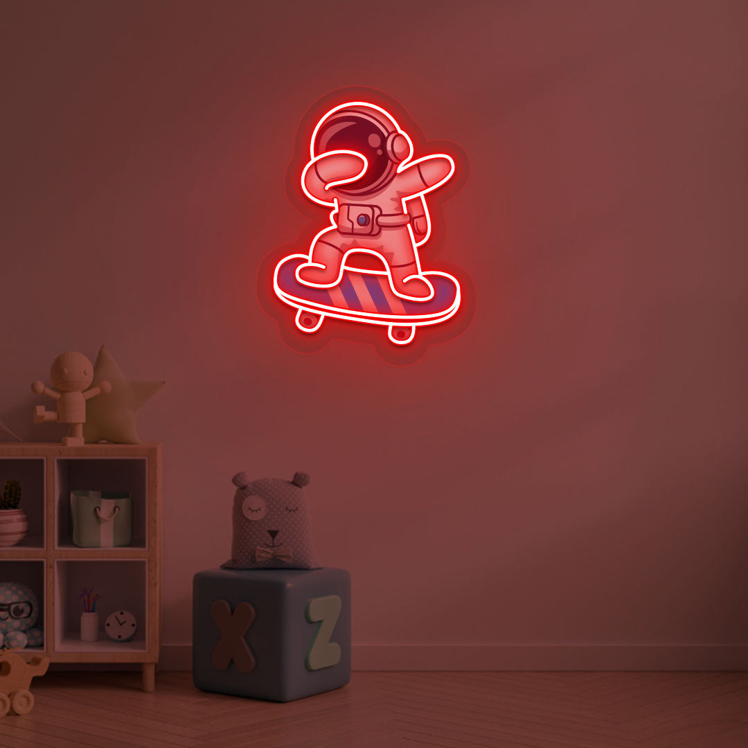 Image of an astronaut skateboard neon sign mounted on a kid's bedroom wall in red color.
