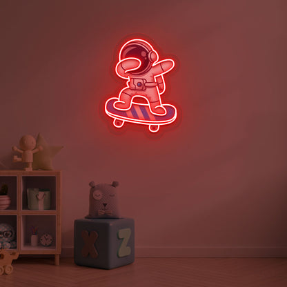 Image of an astronaut skateboard neon sign mounted on a kid's bedroom wall in red color.