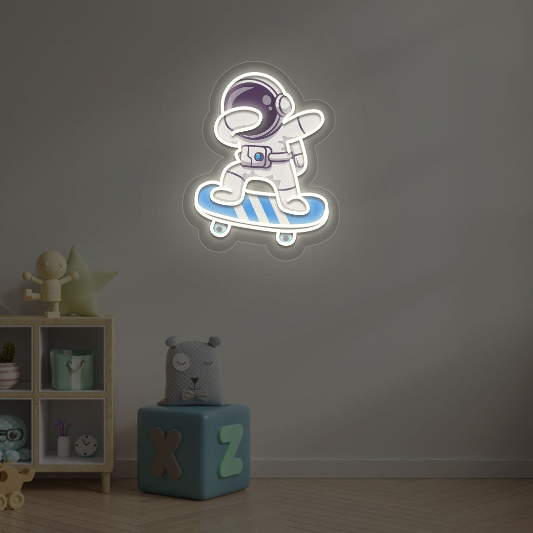 Space-themed kids' room wall with astronaut on skateboard neon sign in warm white LED.
