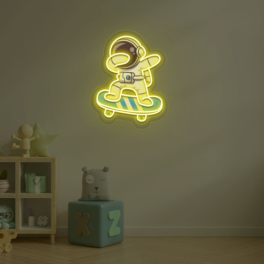 Space-themed kids' room wall with astronaut on skateboard neon sign in yellow LED.