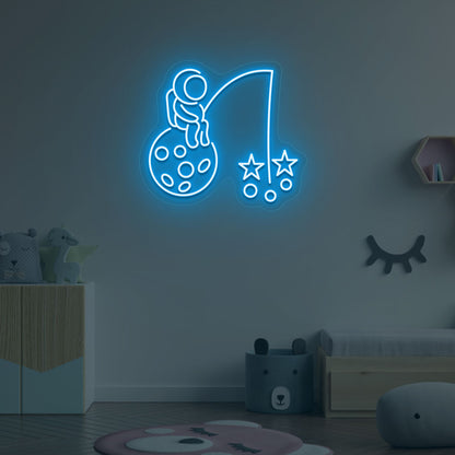 A creative ice blue LED astronaut neon sign catching stars glowing on a kid's room wall. Perfect for playrooms, space-themed interiors, and bedroom wall décor.