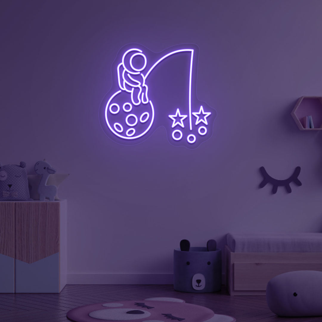 Image of an astronaut with a stars LED neon sign on a kid's room wall in purple color.