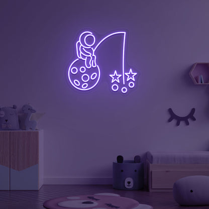 Image of an astronaut with a stars LED neon sign on a kid's room wall in purple color.