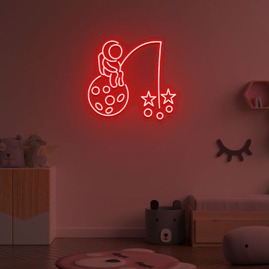 Image of an astronaut with a stars LED neon sign on a kid's room wall in red color.