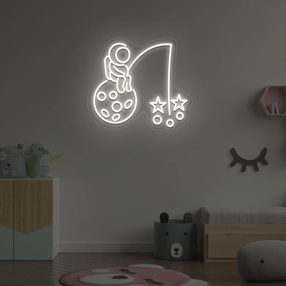 Image of an astronaut with a stars LED neon sign on a kid's room wall in warm white color.