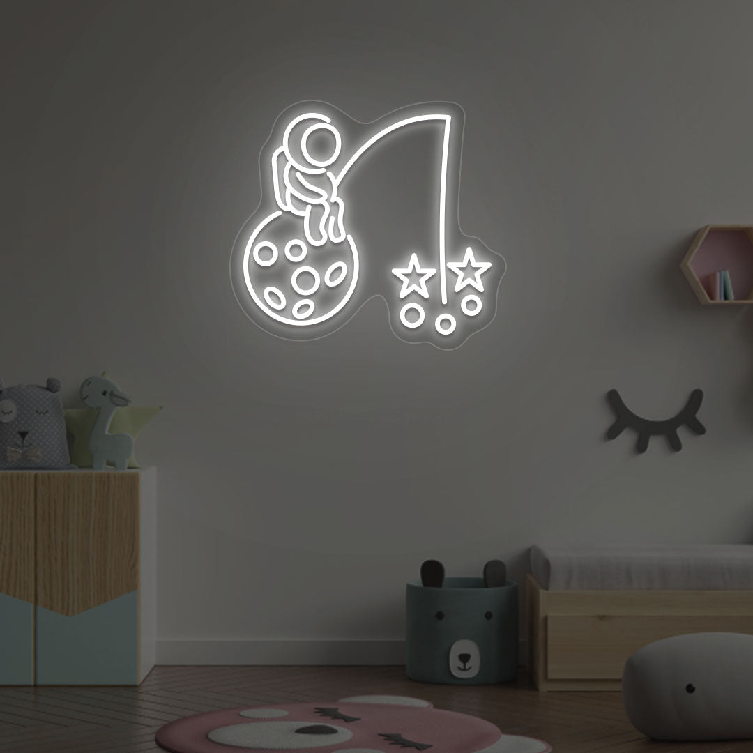 Image of an astronaut with a stars LED neon sign on a kid's room wall in white color.