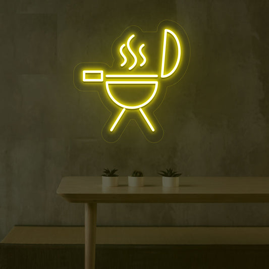 Image of a BBQ neon sign grill machine symbol glowing on a wall in yellow color.