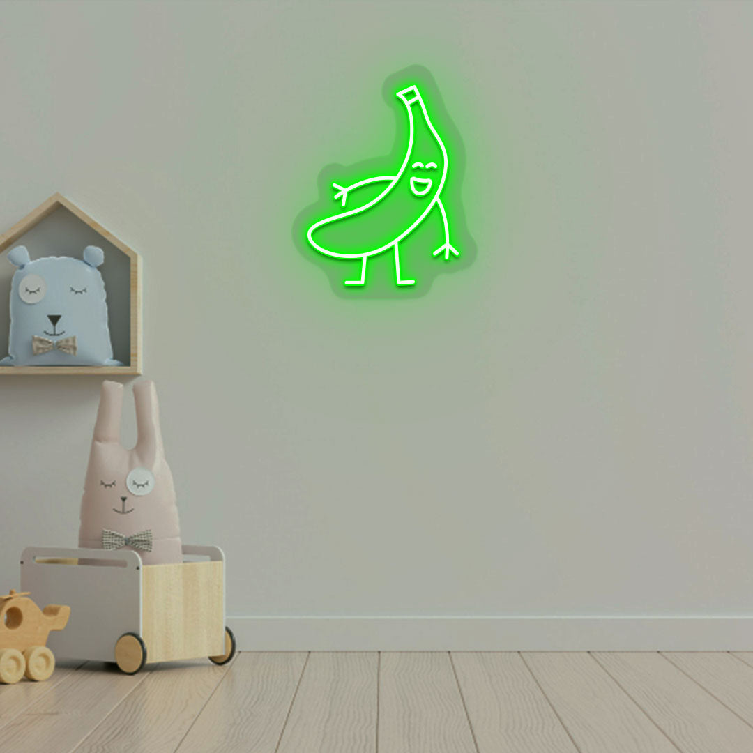 Image of a banana neon sign glowing on a kid's bedroom wall in green color.