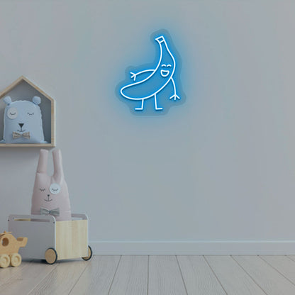 Image of a banana neon sign glowing on a kid's bedroom wall in ice blue color.
