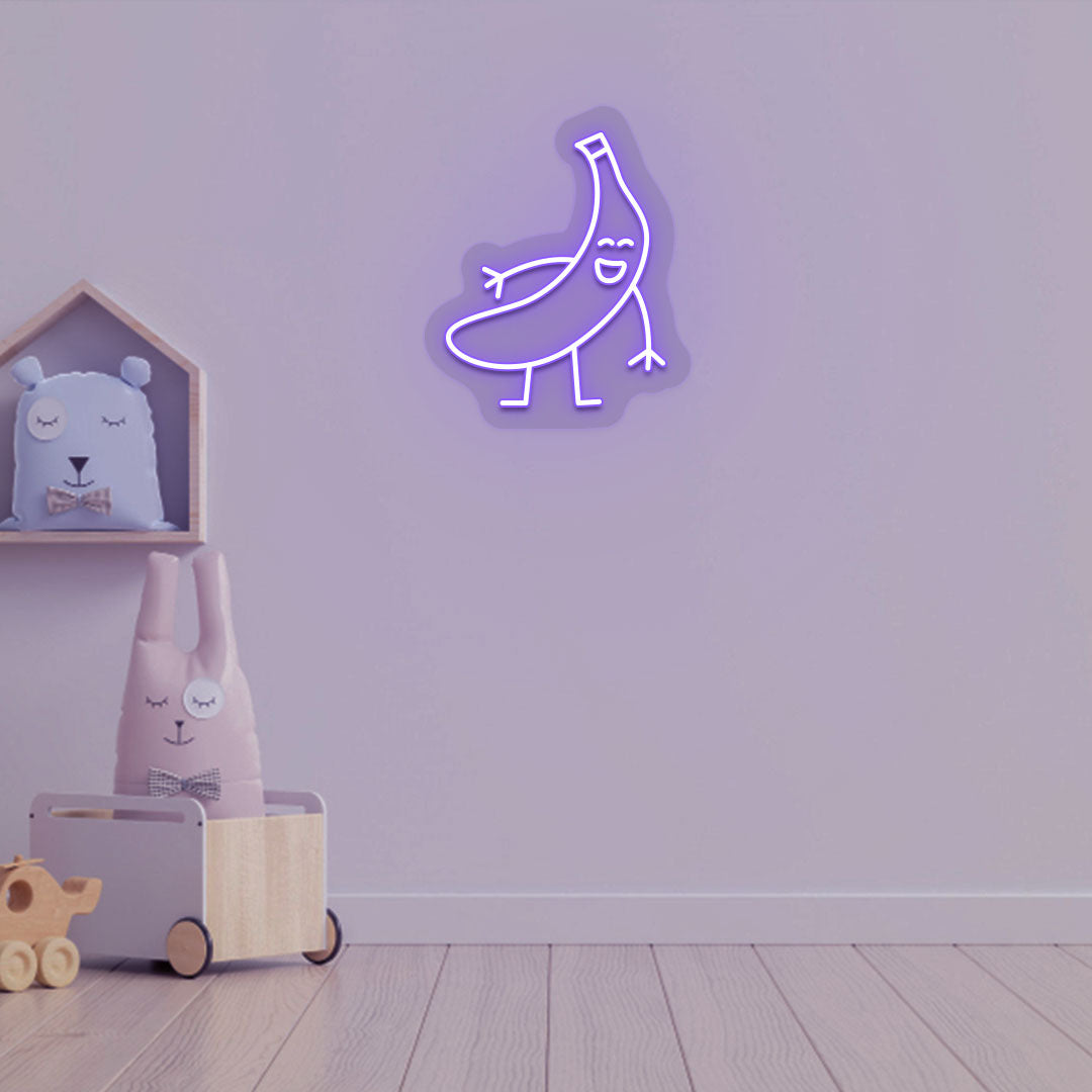 Playroom wall decor with a banana neon sign in purple LED. Perfect for kids’ rooms, nursery wall décor, and bedroom décor.