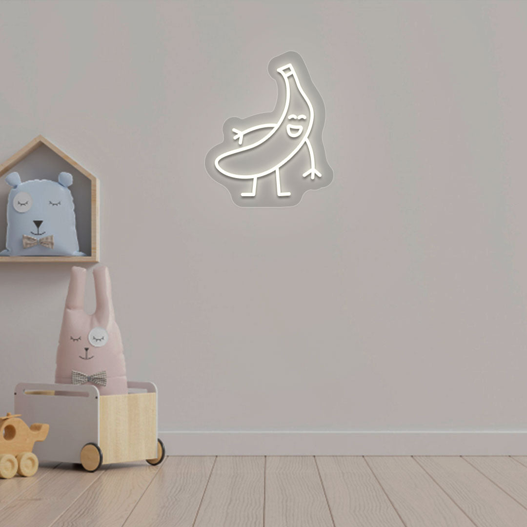 Playroom wall decor with a banana neon sign in warm white LED. Perfect for kids’ rooms, nursery wall décor, and bedroom décor.