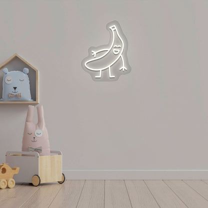 Playroom wall decor with a banana neon sign in warm white LED. Perfect for kids’ rooms, nursery wall décor, and bedroom décor.