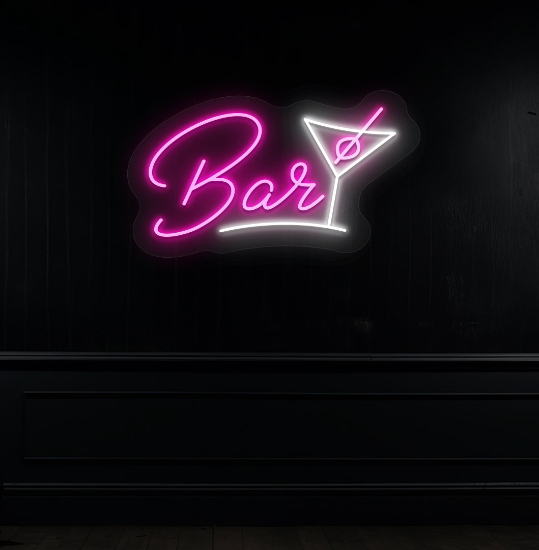 Modern pink LED bar neon sign with cocktail glass hanging on a dark wall. 