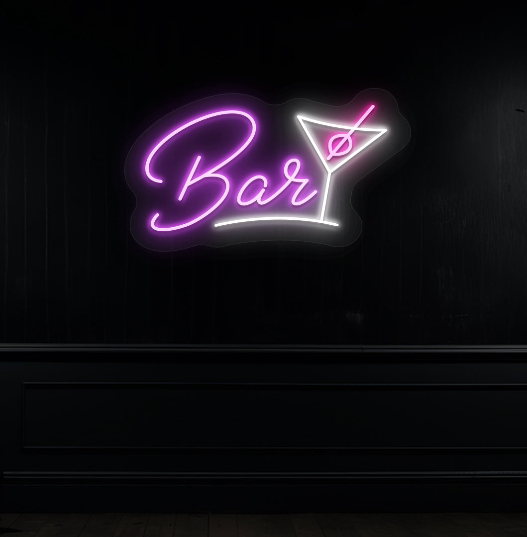 Image of a bar cocktail neon sign in purple LED glowing on a modern bar wall with a cocktail glass.