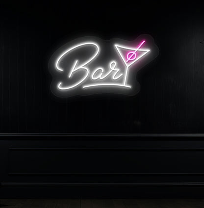 Modern white LED bar neon sign with cocktail glass hanging on a dark wall. 