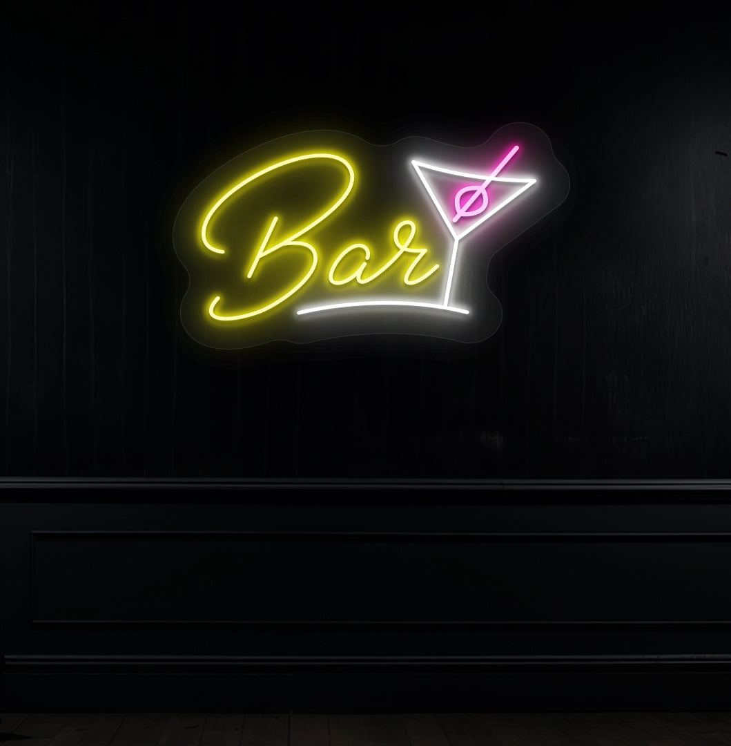 Image of a bar cocktail neon sign in yellow LED glowing on a modern bar wall with a cocktail glass.