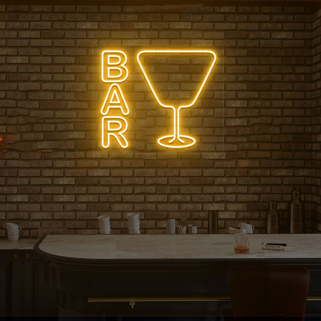 Stylish bar neon sign in orange with glass design on modern wall.