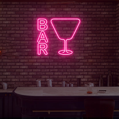 Lounge wall with bar neon sign and glass icon in pink LED. Perfect for bars, home bar setups, parties, and event décor.