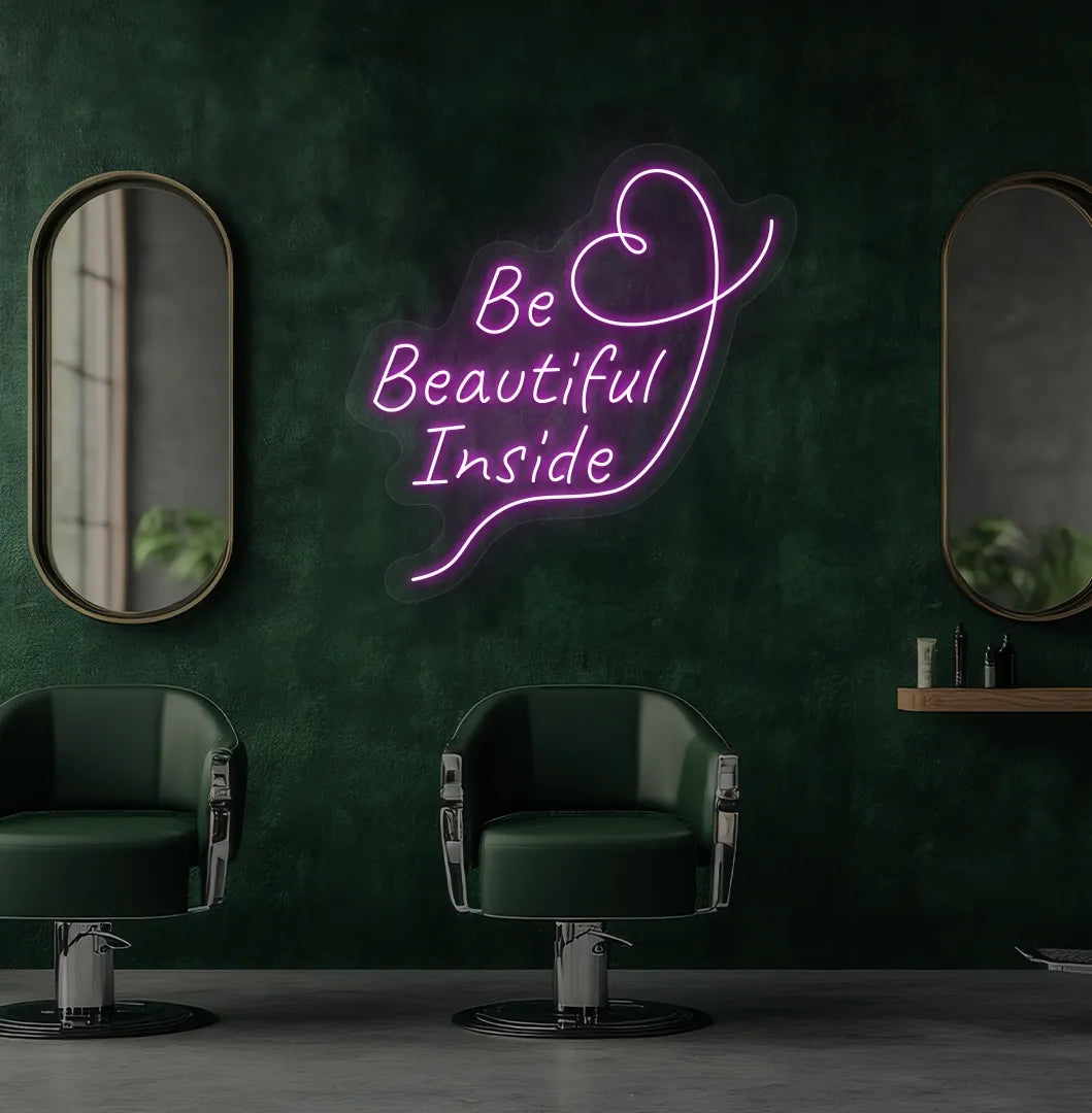 Modern salon aesthetic wall with "be beautiful inside" neon sign glowing purple.