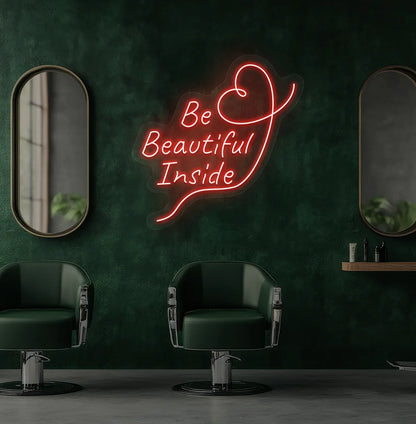 Image of an aesthetic salon wall with "be beautiful inside" neon sign glowing red.