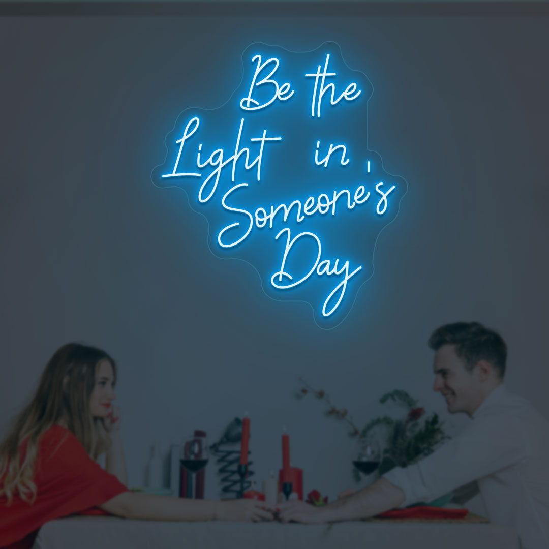 Aesthetic wall with "Be the light in someone's day" ice blue neon sign. 