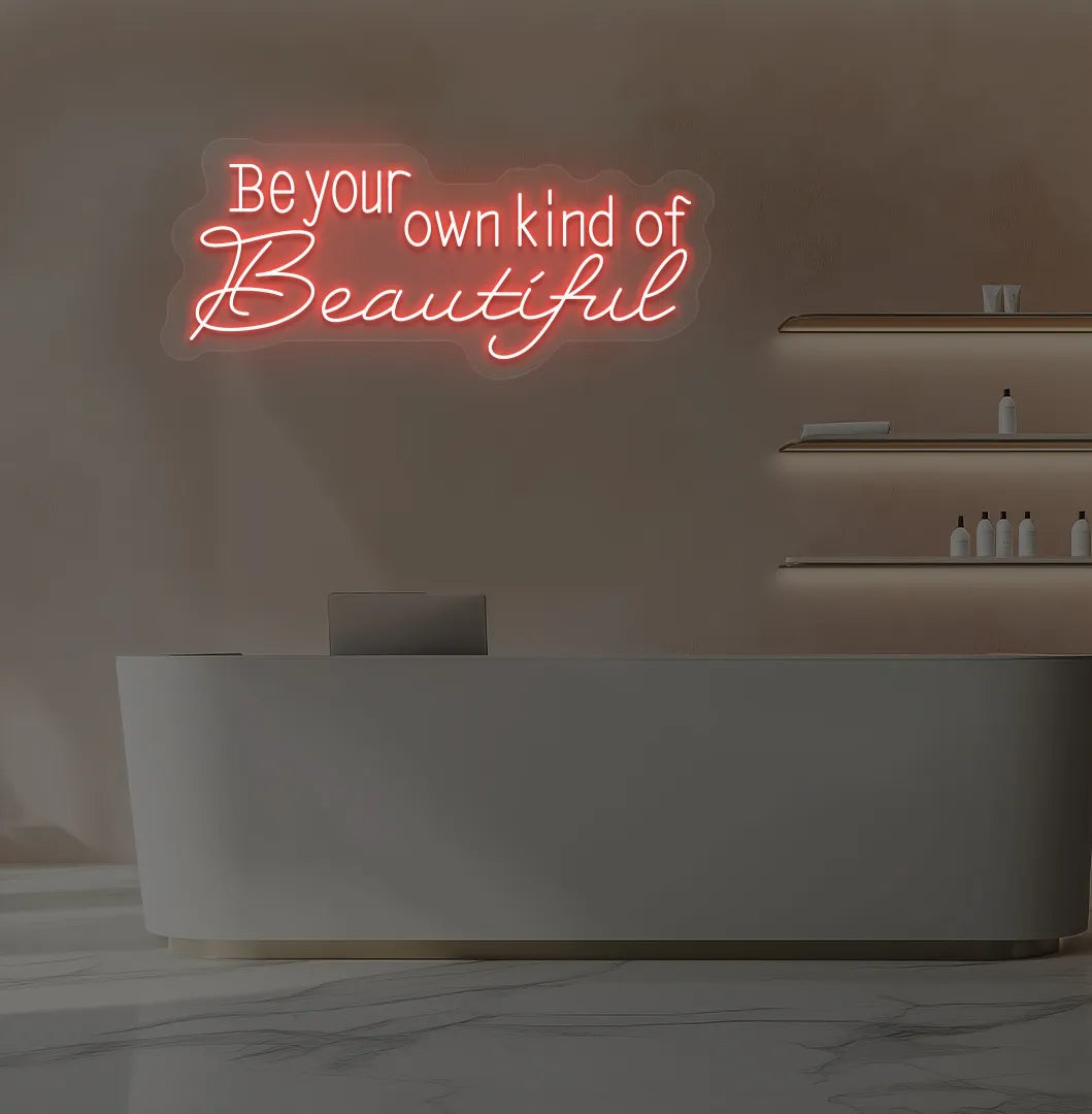 Image of a bright red "be your own kind of beautiful" neon sign for salon wall decor.